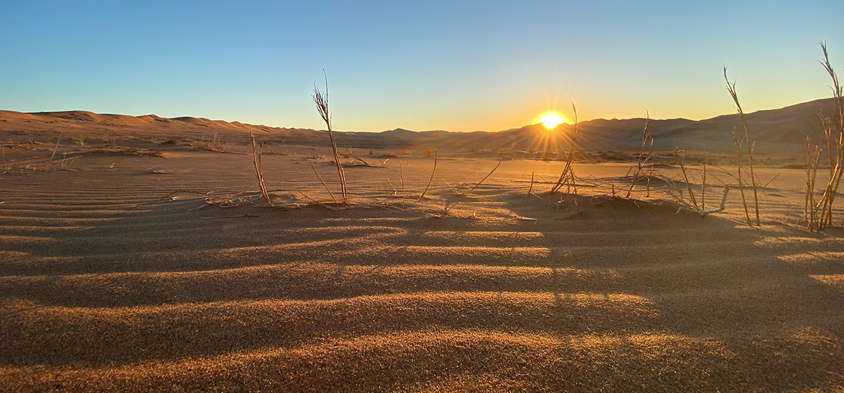 view of the sunrise over the desert